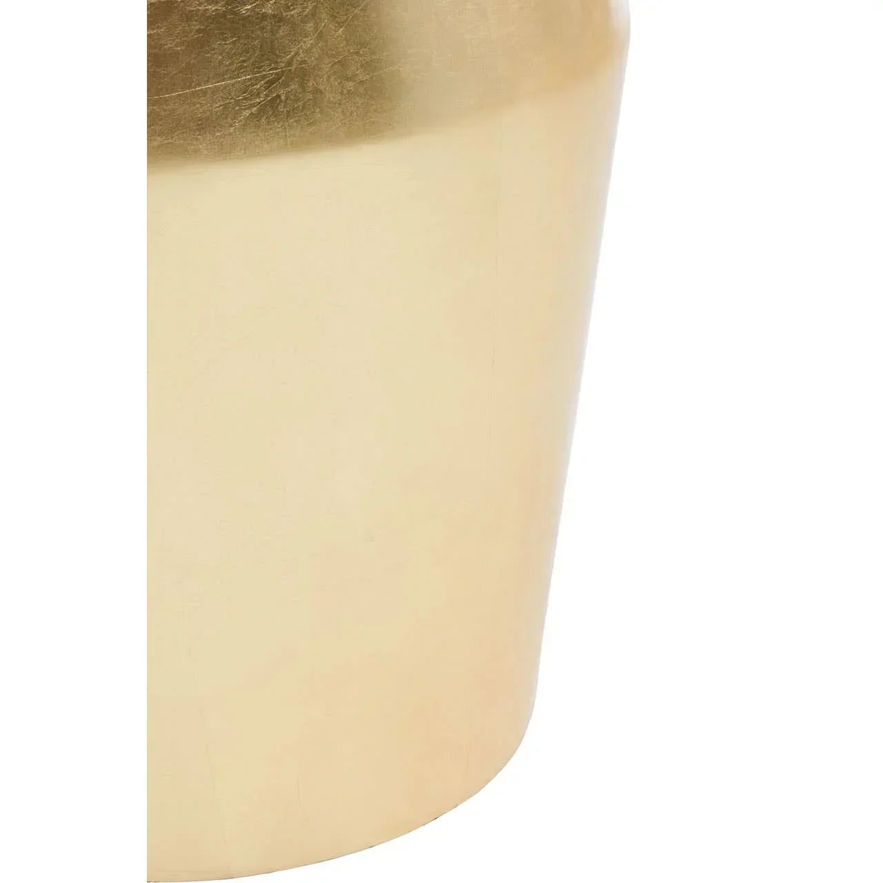 Close-up of gold metal side table base with smooth matte finish