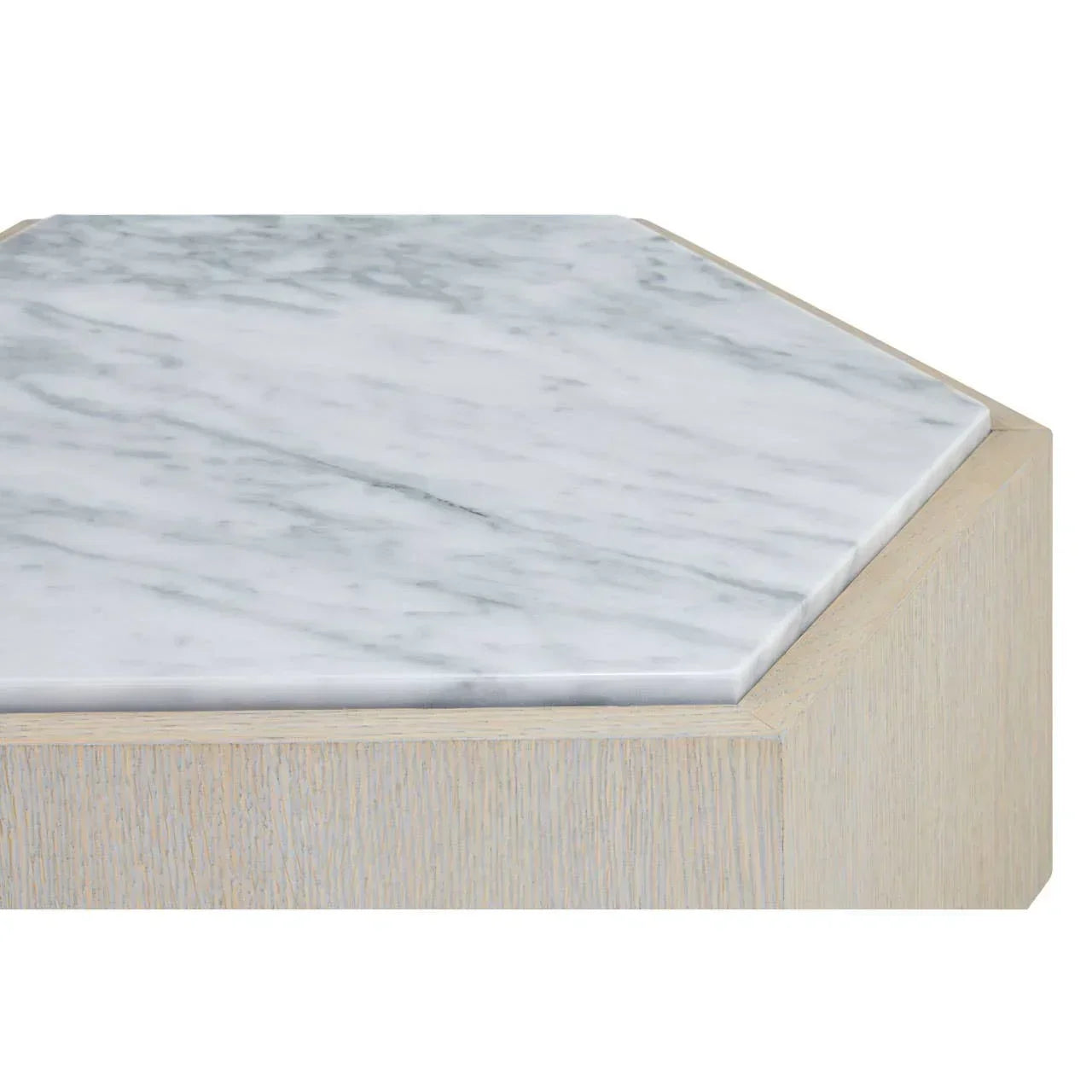 Hexagonal marble coffee table top with light wood base, close-up view