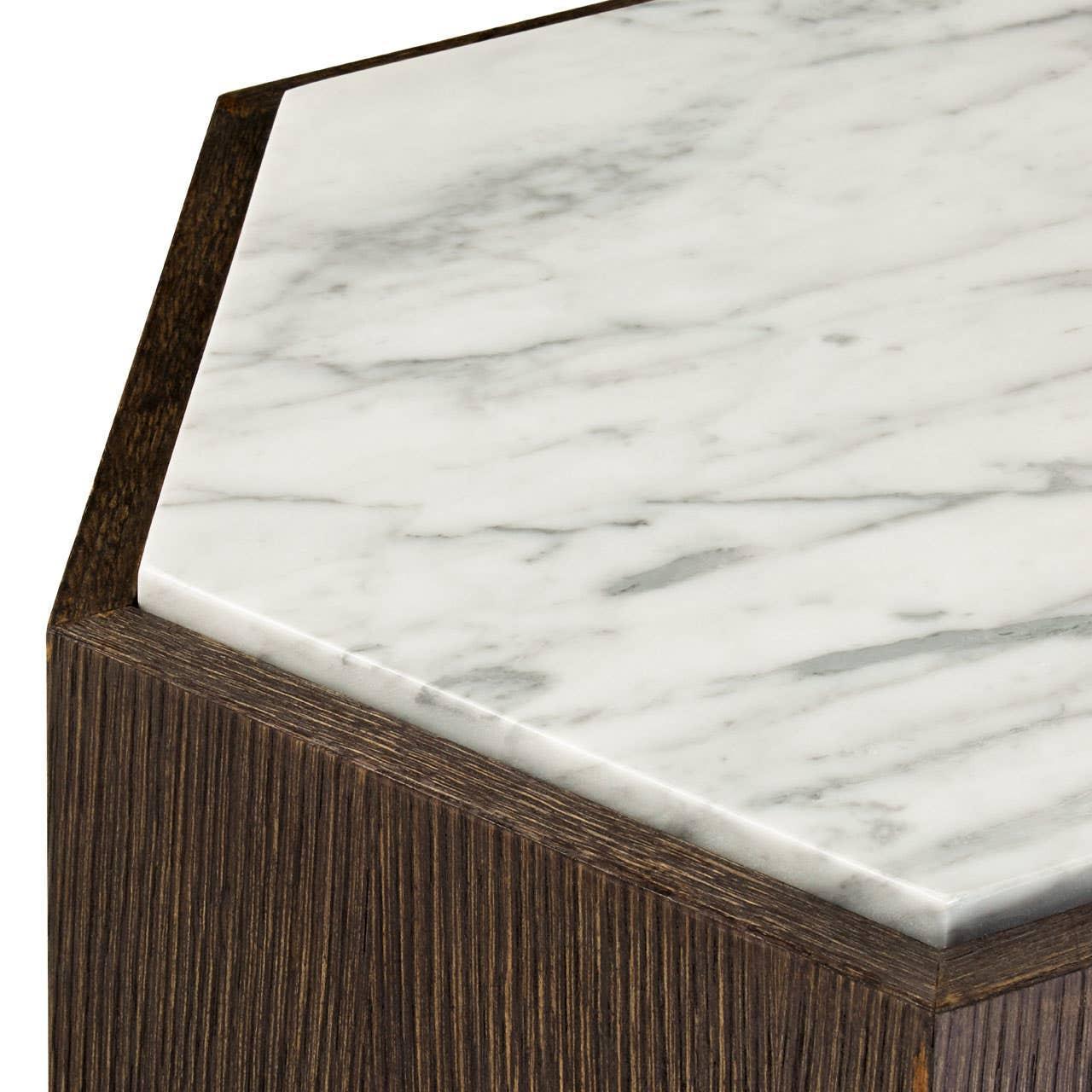 Hexagonal side table with white marble top and dark wood base, close-up of corner detail