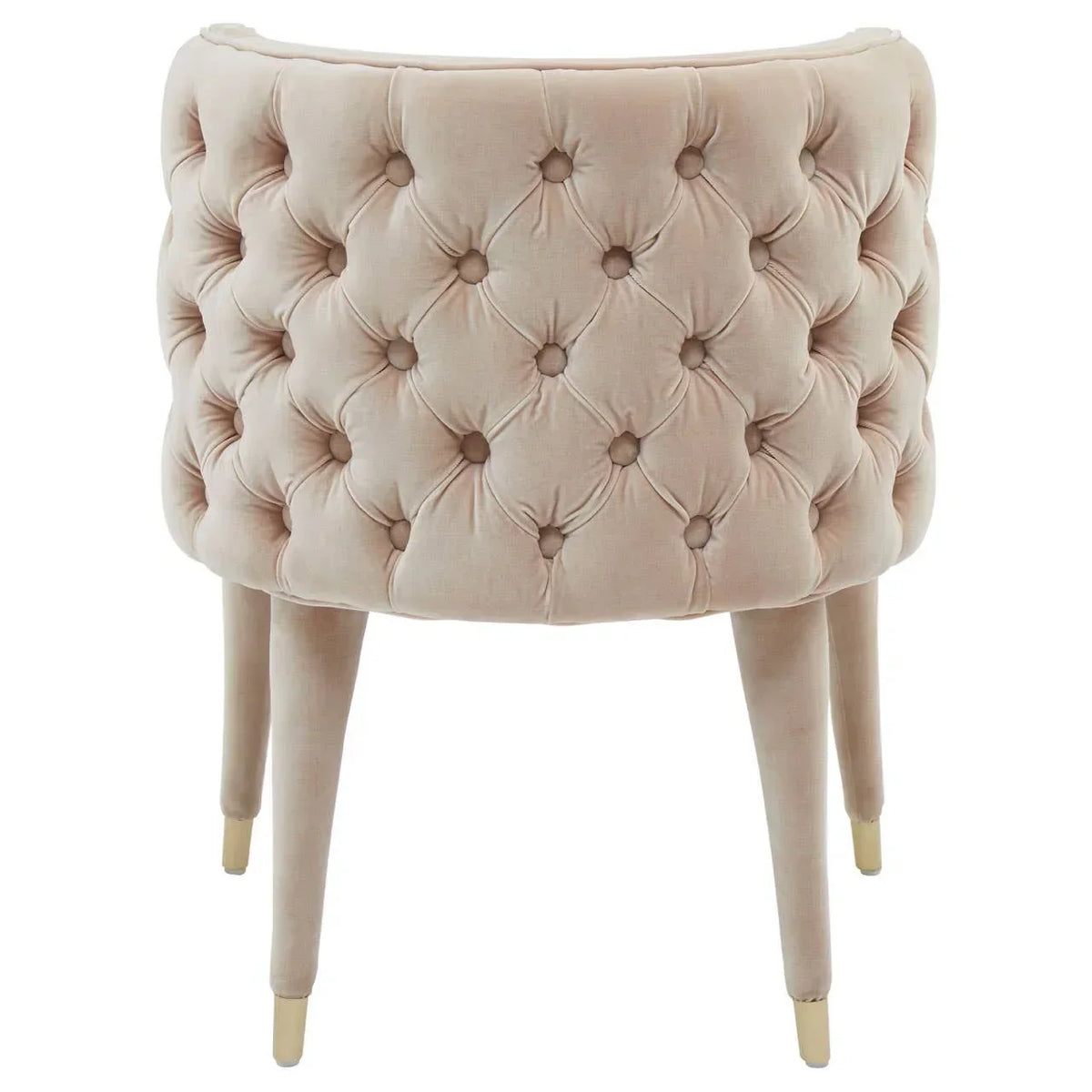 Beige velvet accent chair with button-tufted back and gold-tipped legs, rear view
