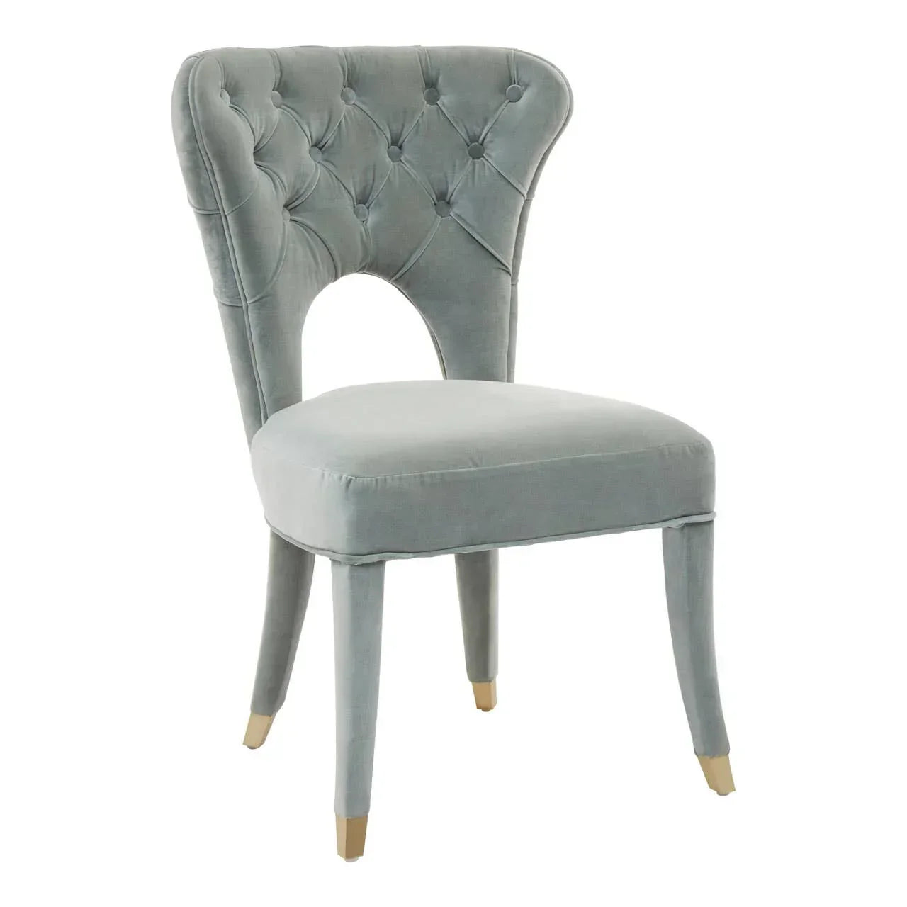 Grey velvet dining chair with button-tufted backrest and gold-tipped legs