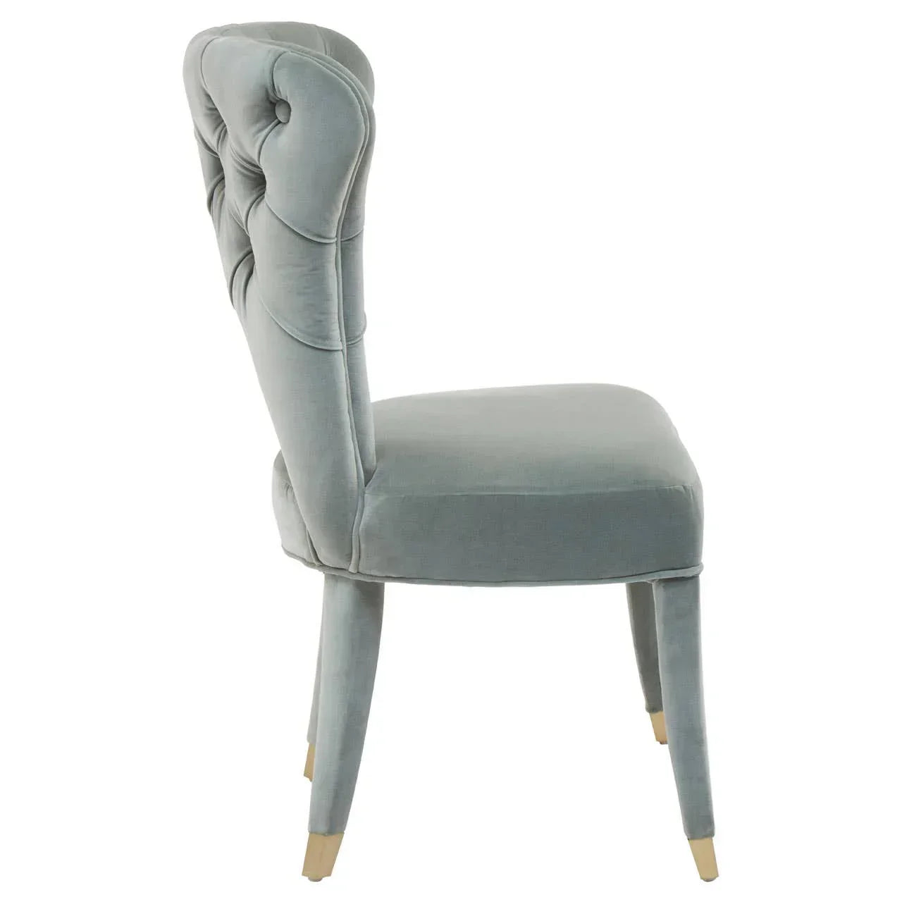 Side view of grey velvet dining chair with tufted back and wooden legs