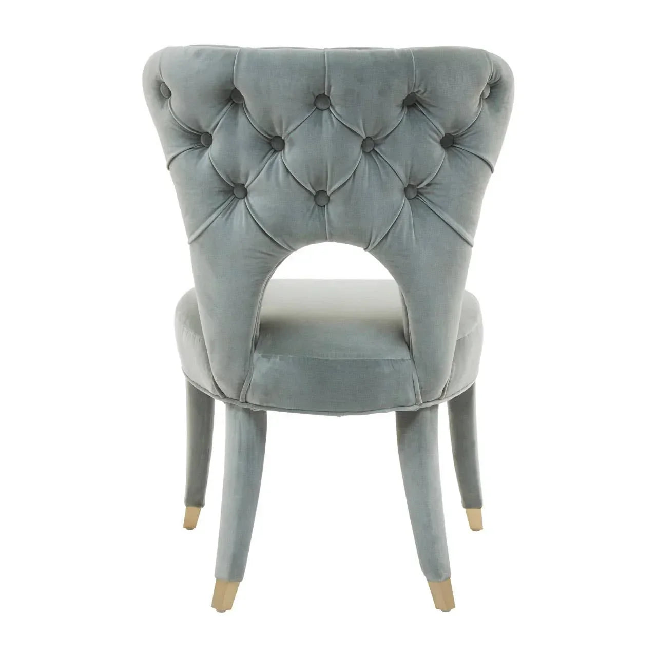 Grey velvet dining chair with tufted backrest and cut-out detail, rear view
