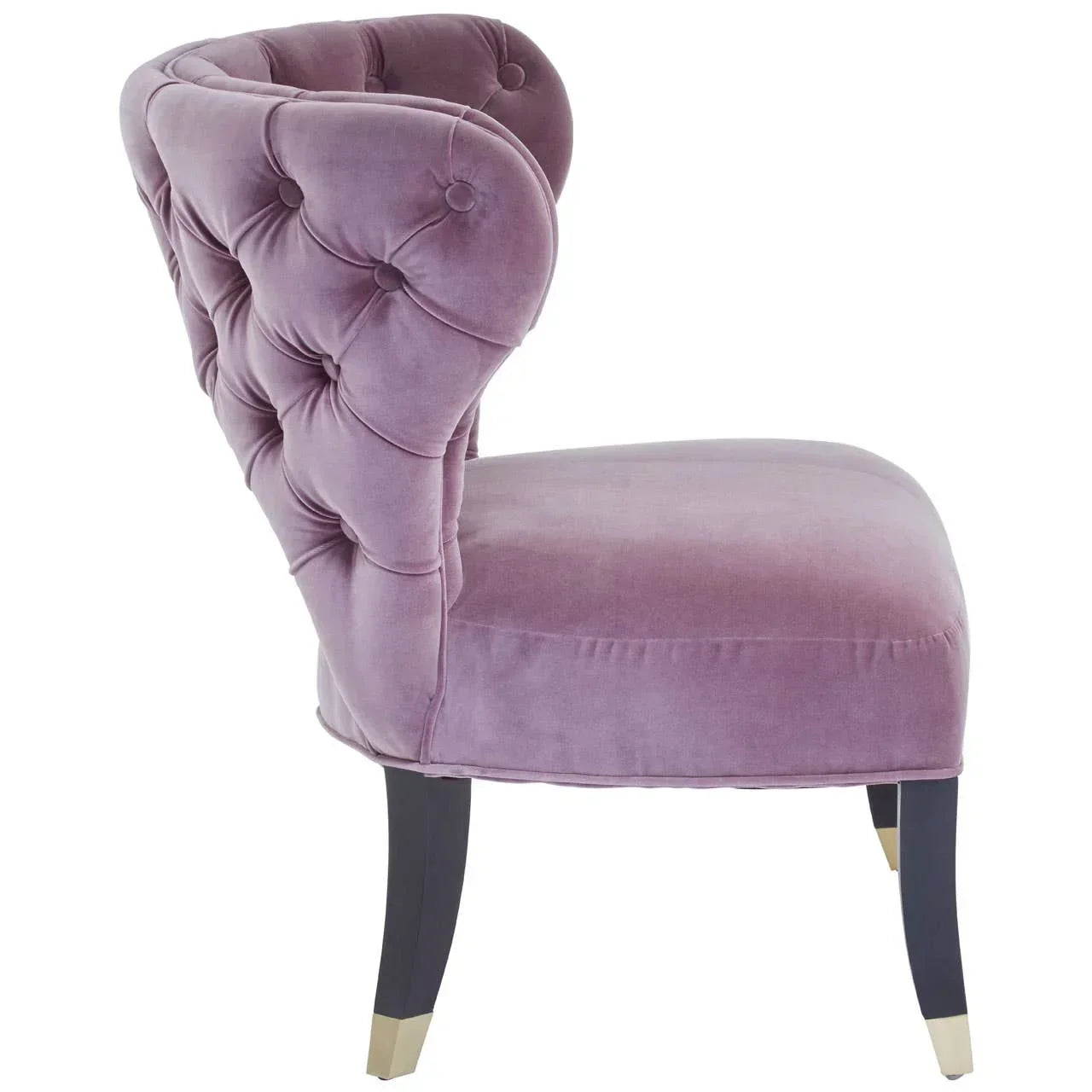 Mauve velvet accent chair with button tufted back and dark wooden legs, side view