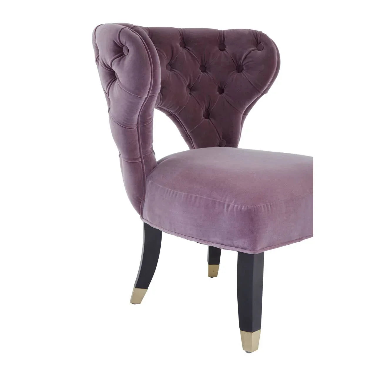 Purple velvet accent chair with button-tufted back and black legs with gold tips