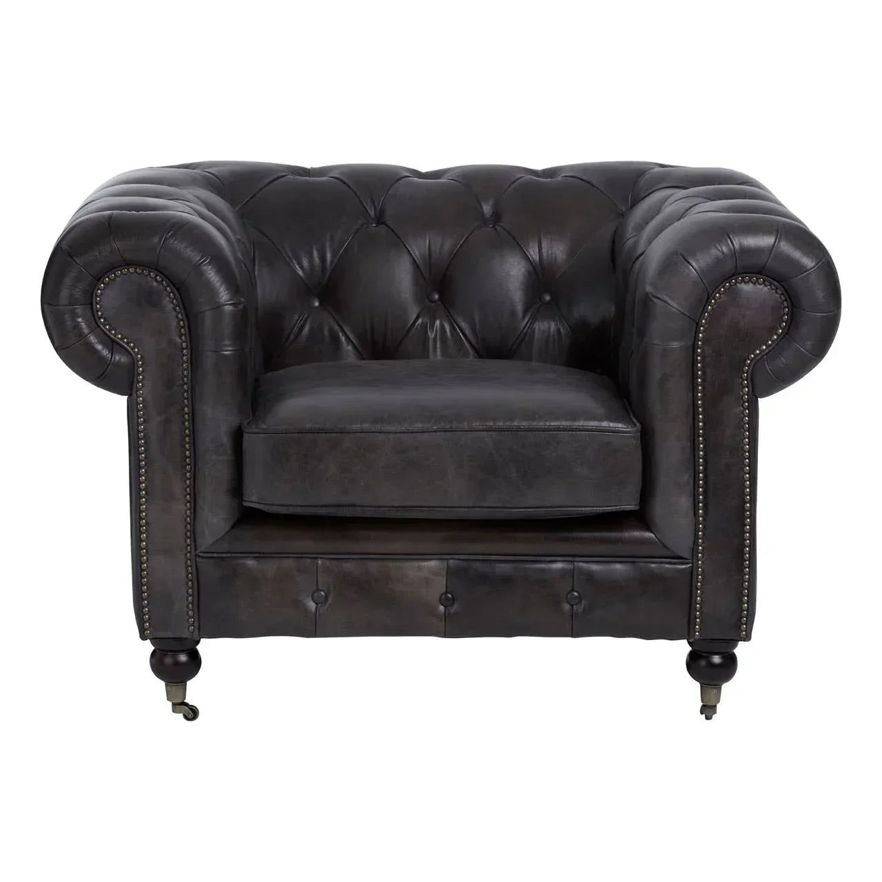 Black leather Chesterfield armchair with button tufting and studded rolled arms