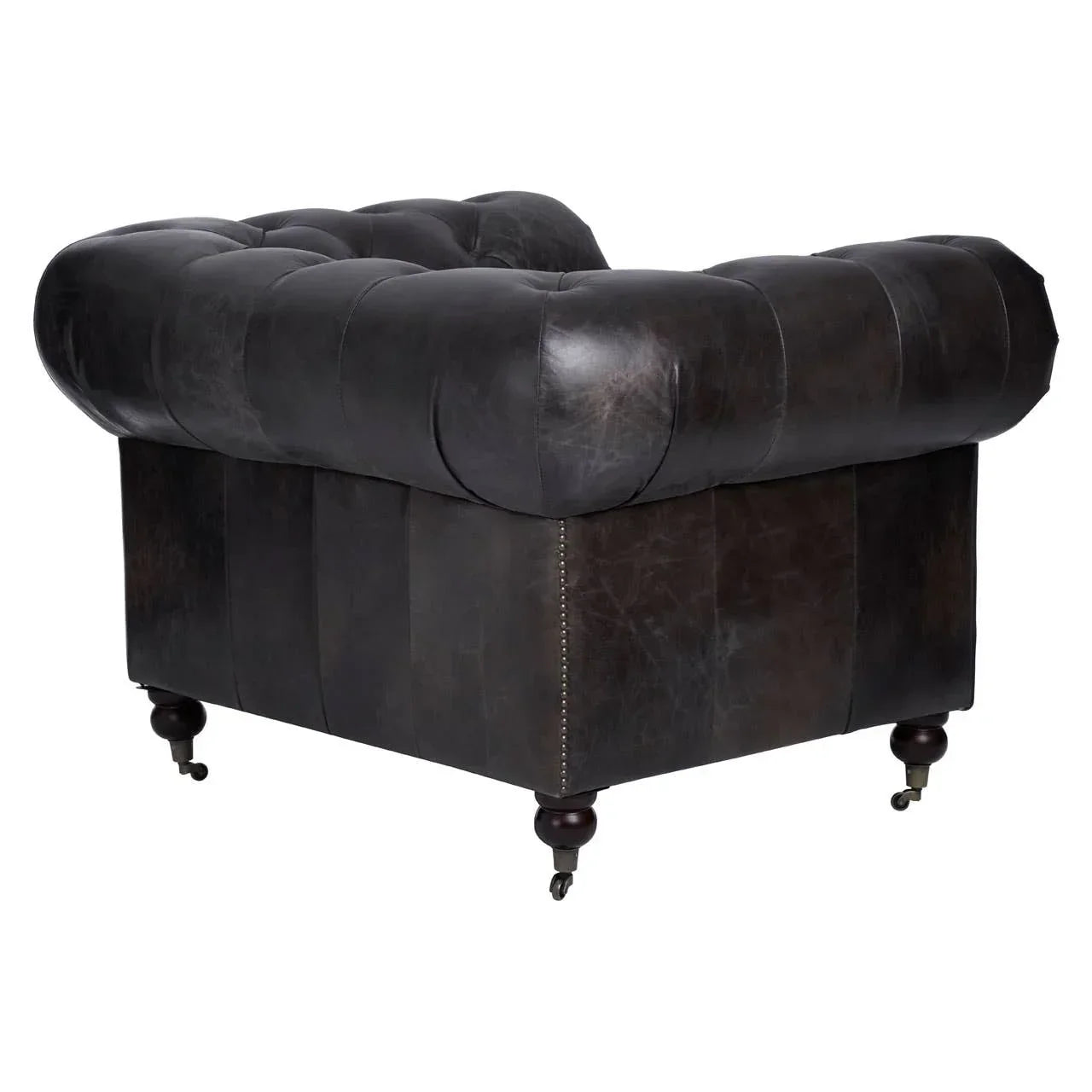 Dark brown leather Chesterfield armchair with tufted back and wooden legs on castors