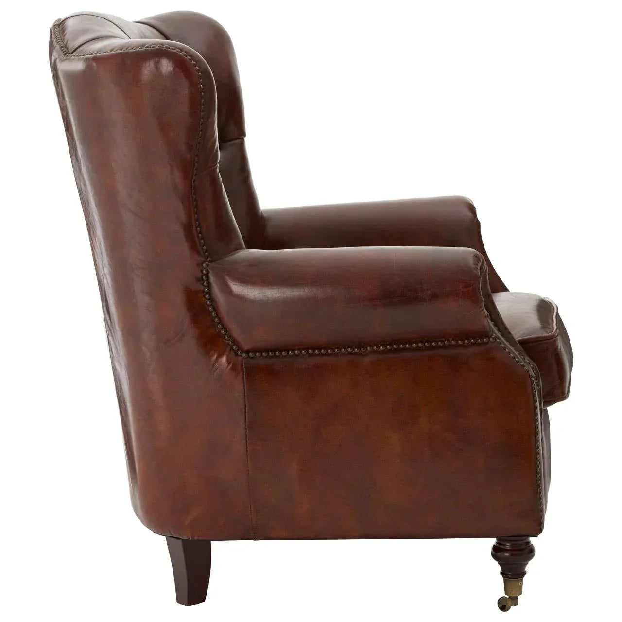 Side profile of brown leather armchair with studded trim and wooden legs
