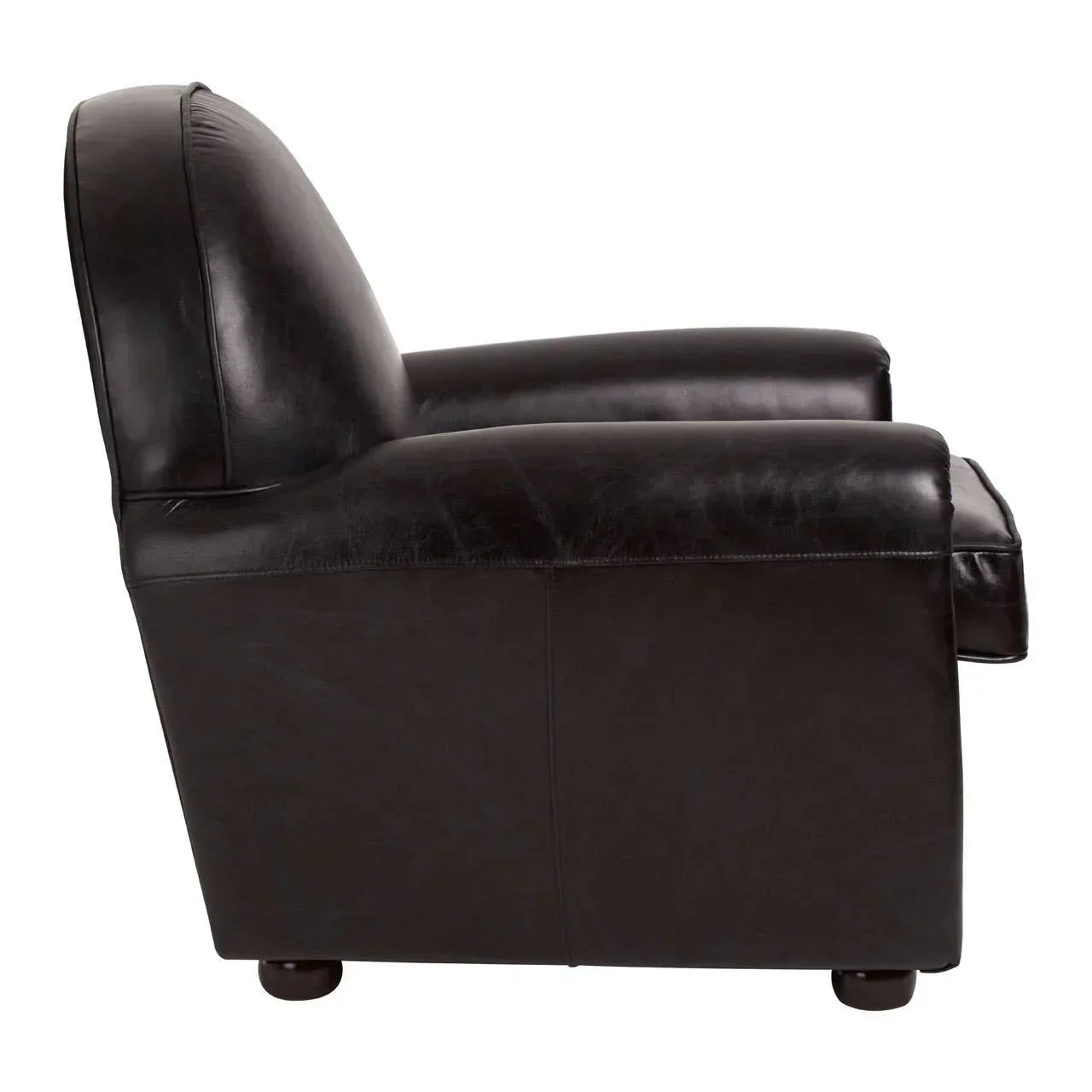 Side view of dark brown leather armchair with padded back and rounded armrests