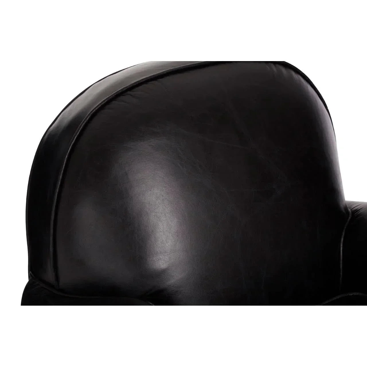 Closeup of black leather armchair backrest with smooth surface and subtle stitching detail