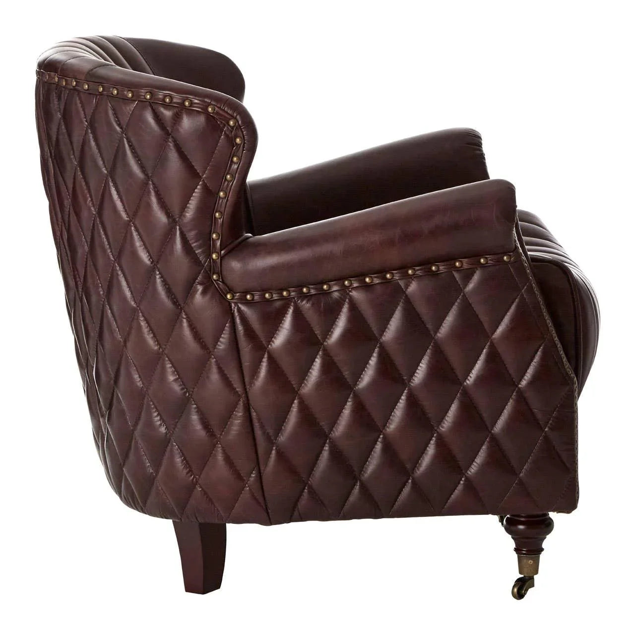 Brown leather armchair with diamond quilted upholstery and brass stud detail side view