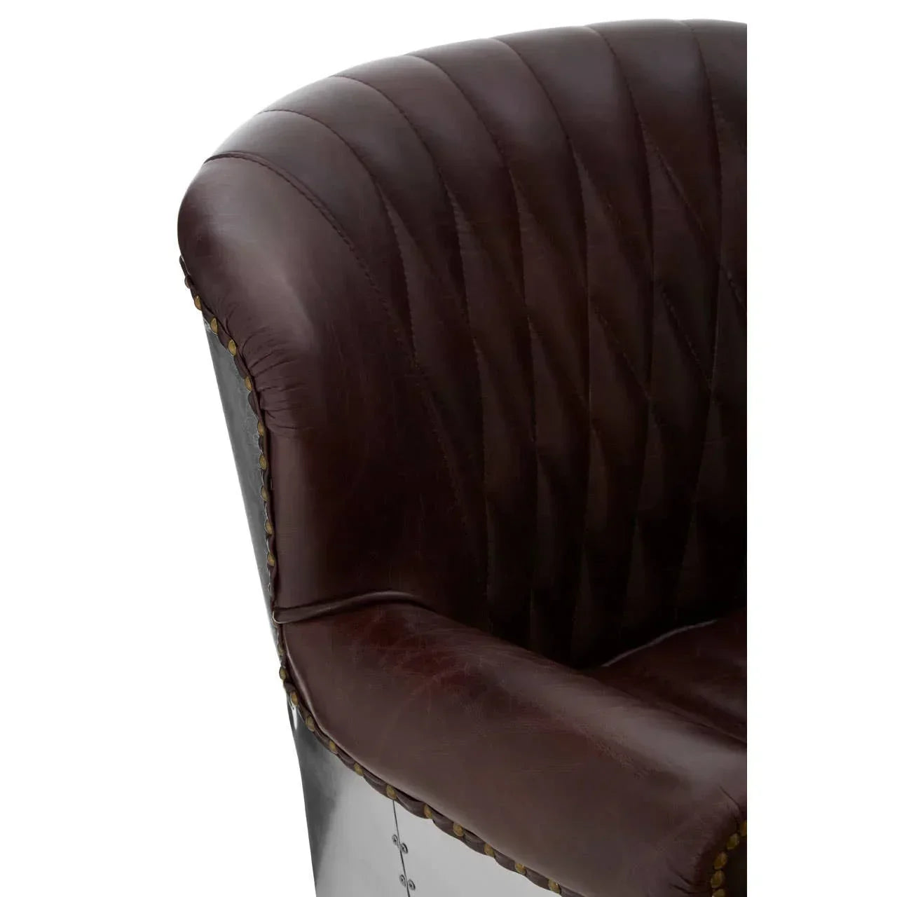 Closeup of brown leather armchair with stitched backrest and metal side panel