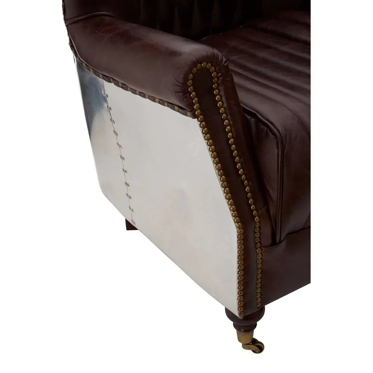 Brown leather armchair with metallic studded trim and riveted side panel detail