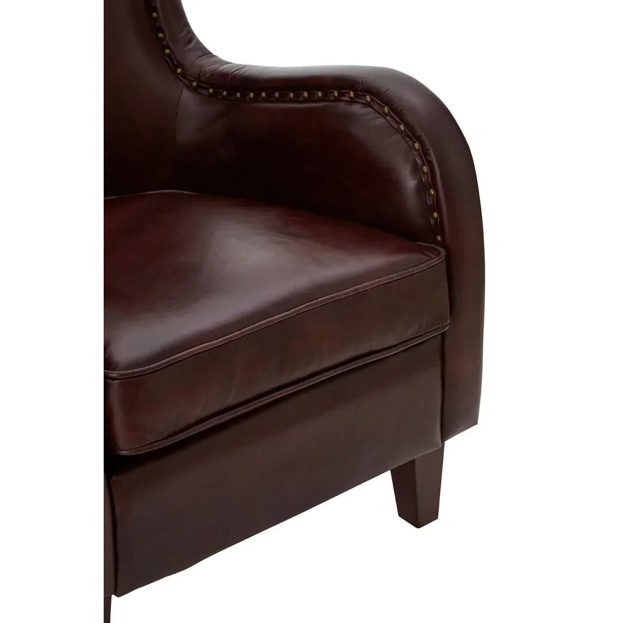 Brown leather armchair with nailhead trim and curved armrest detail