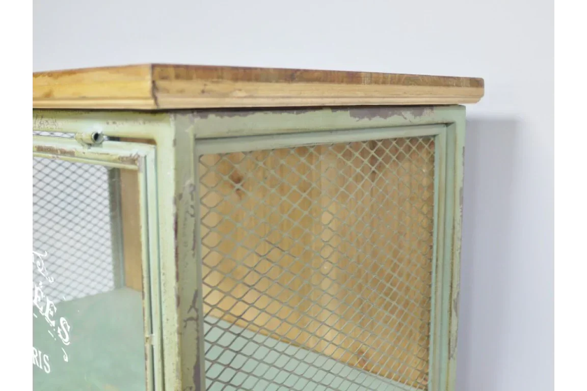 Industrial cabinet with distressed metal mesh door and wooden top corner view