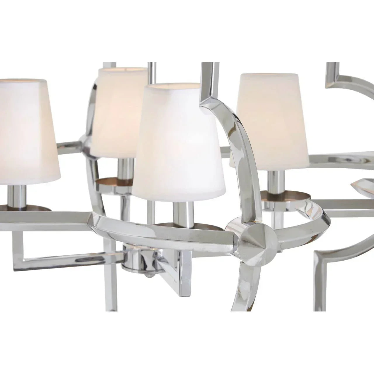 Chrome chandelier with white glass shades close-up showing modern lighting design