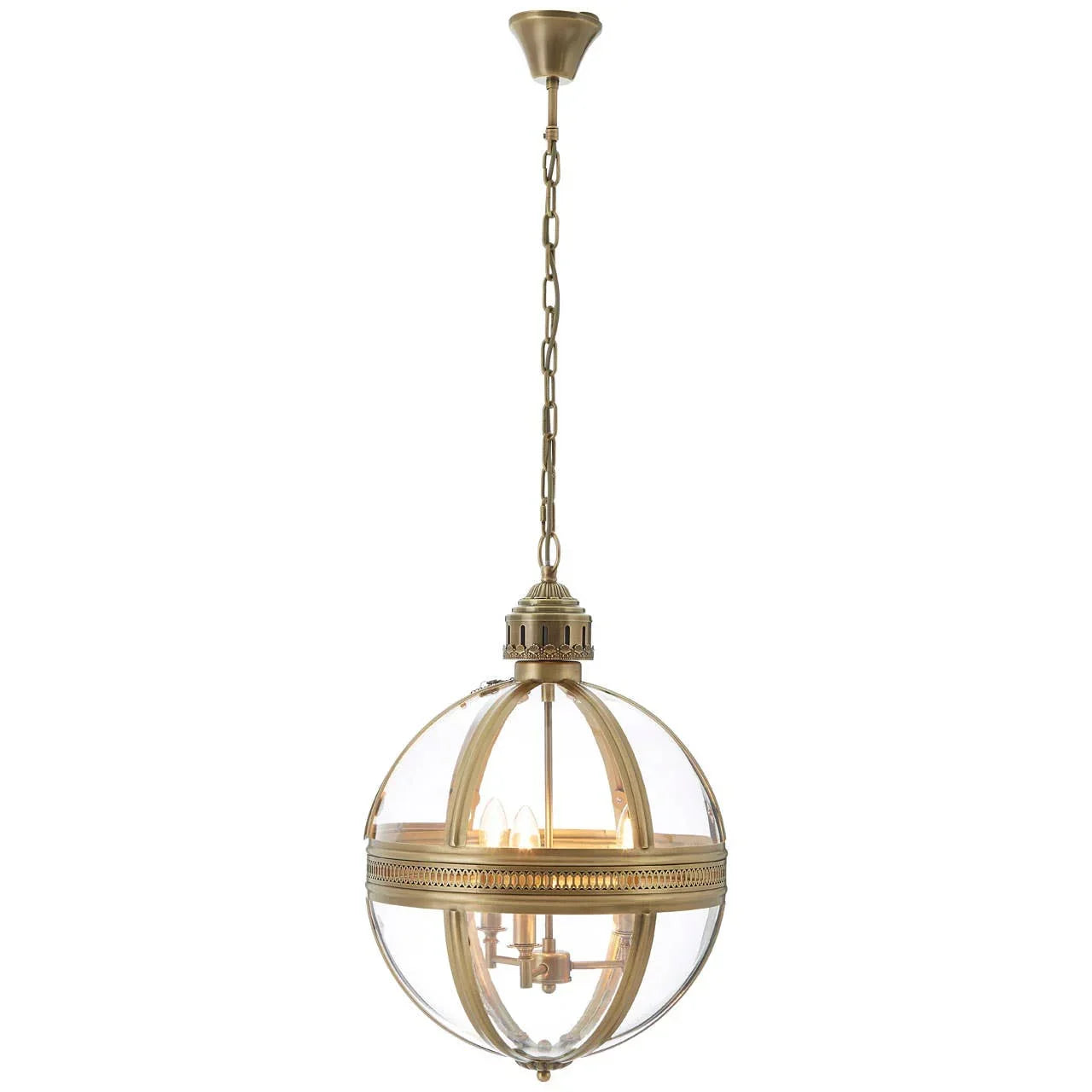 Brass and glass globe pendant light with chain hanging from ceiling