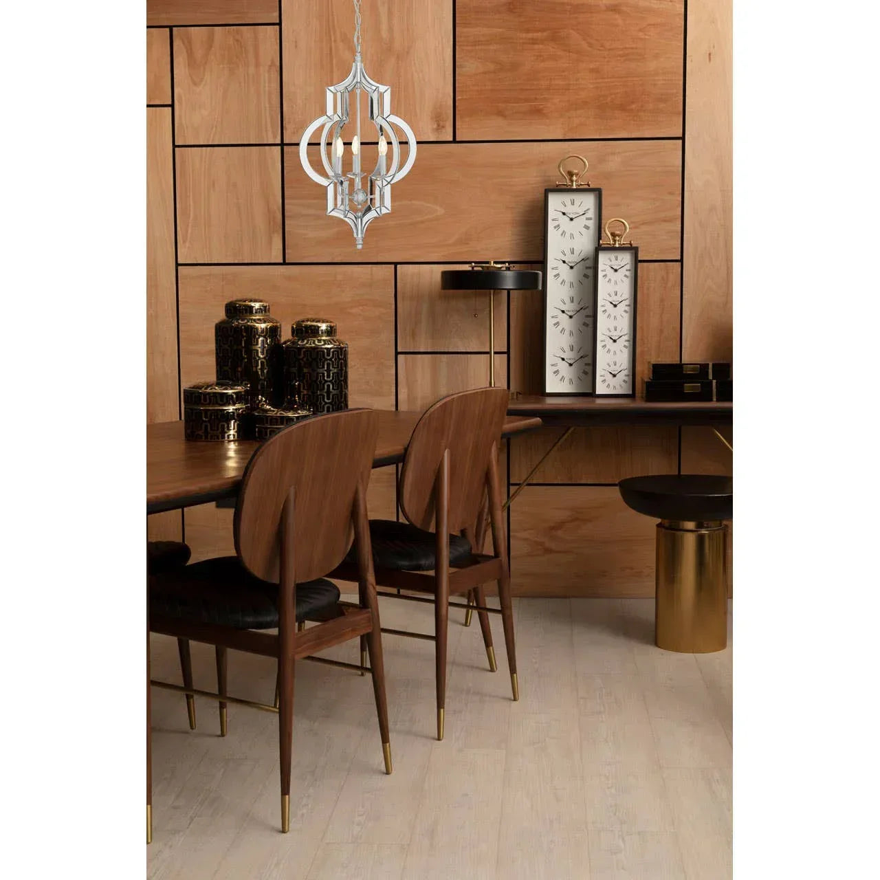 Modern dining room set with wooden chairs, gold accents and decorative jars on wooden floor