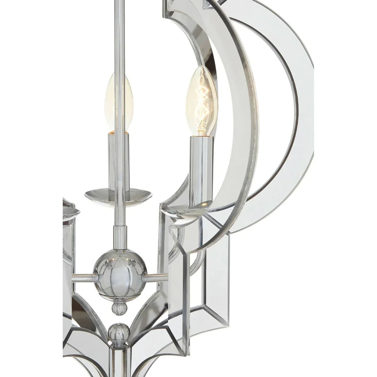 Chrome chandelier close-up with mirrored geometric frame and exposed candle bulbs