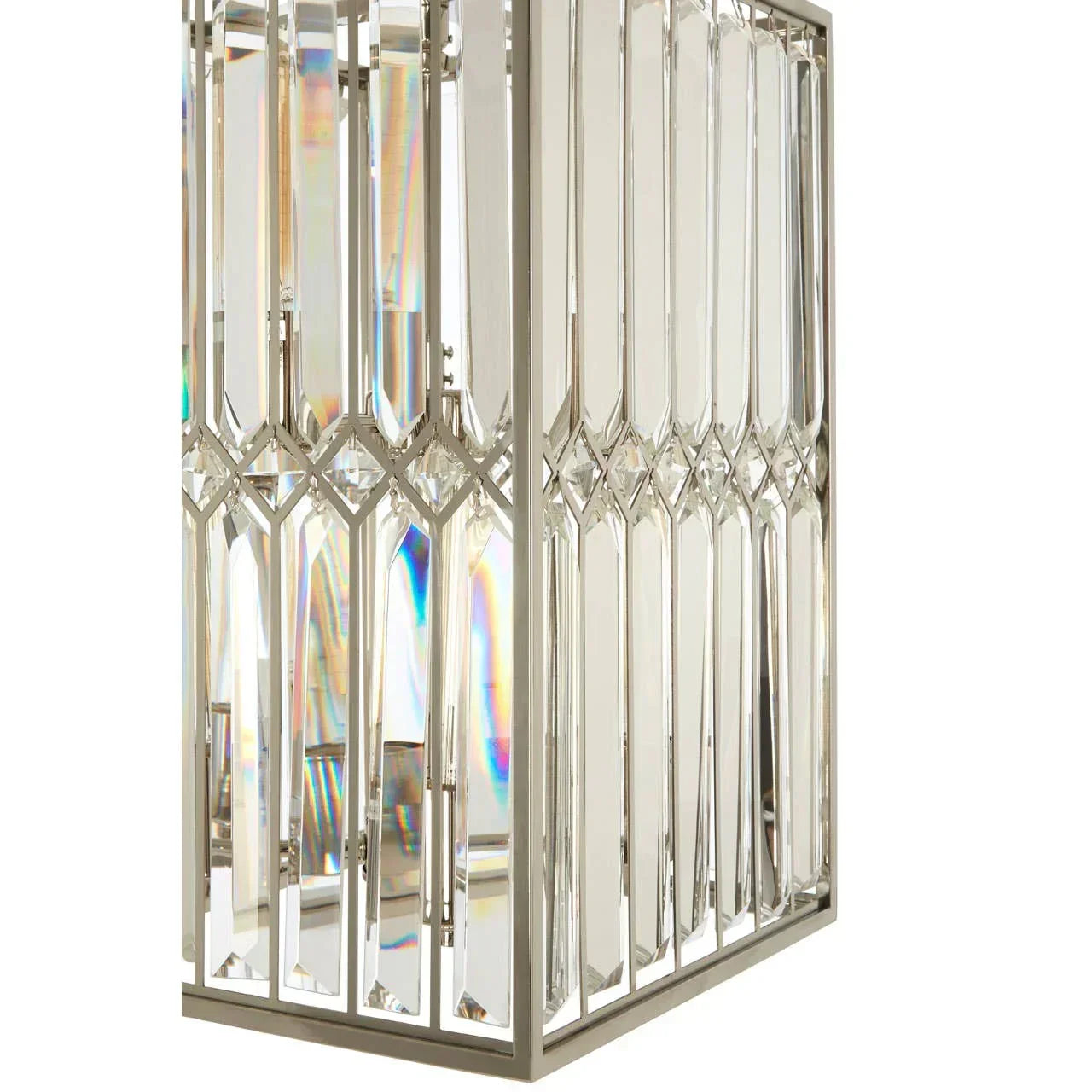 Close-up of crystal table lamp with chrome frame and geometric diamond detailing
