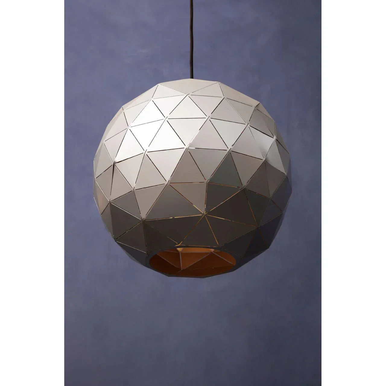 Geometric metal pendant light with faceted dome design against blue background