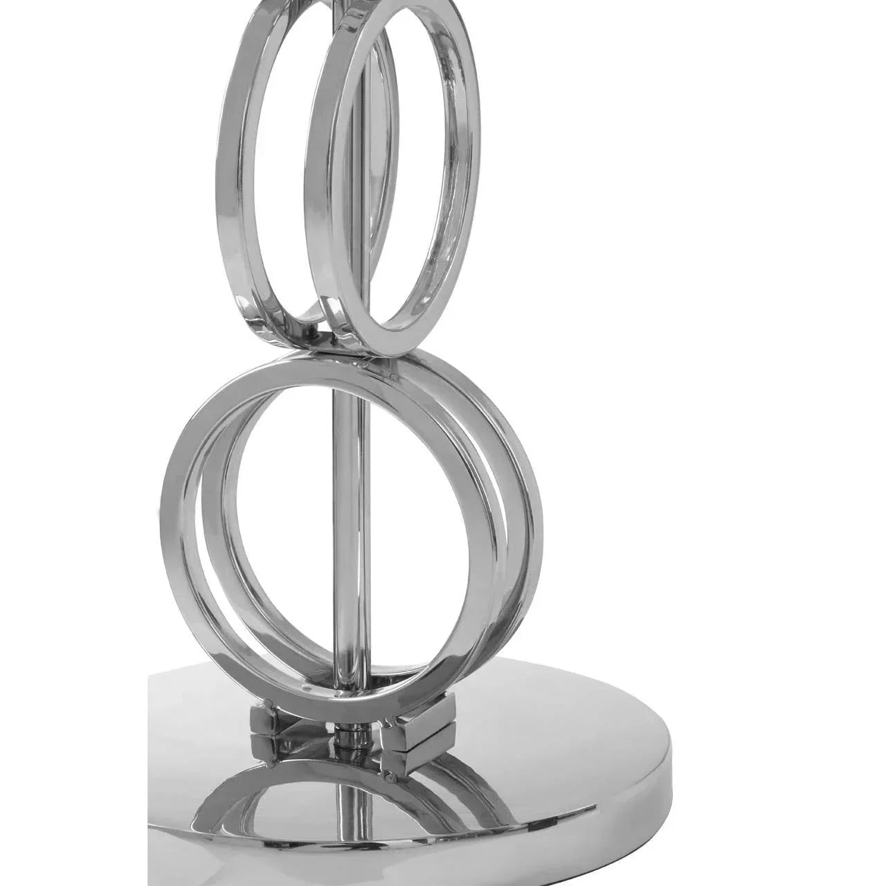 Close-up of modern chrome lamp base with interlocking ring design