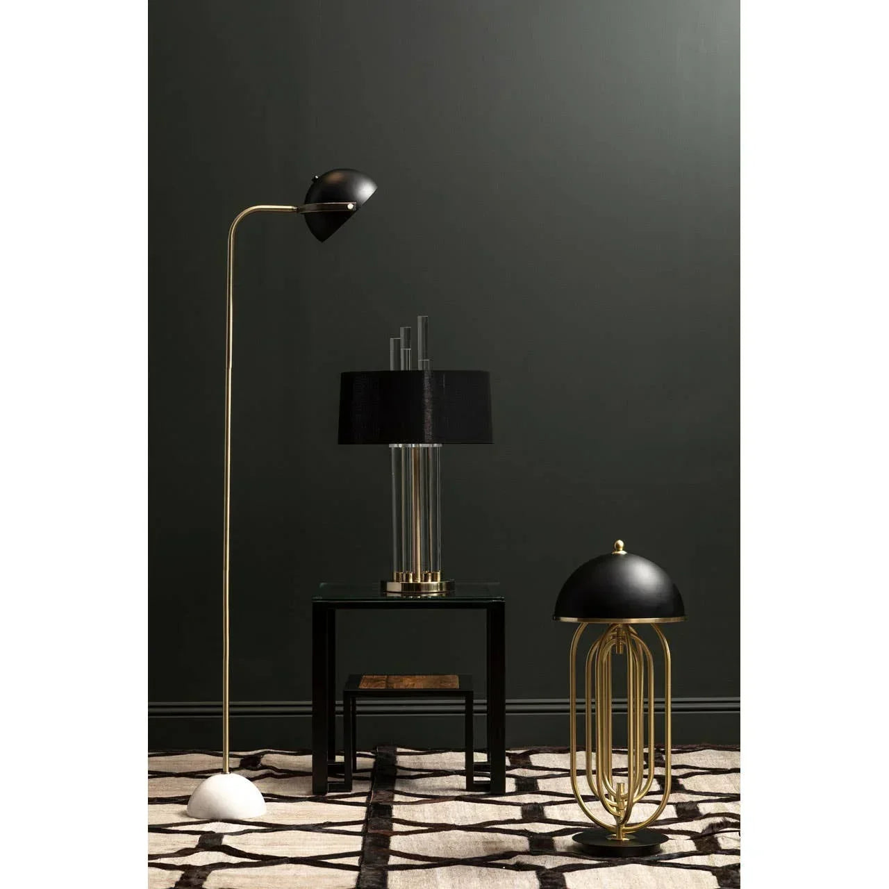 Modern black and gold floor lamp, table lamp, and side lamp on patterned rug