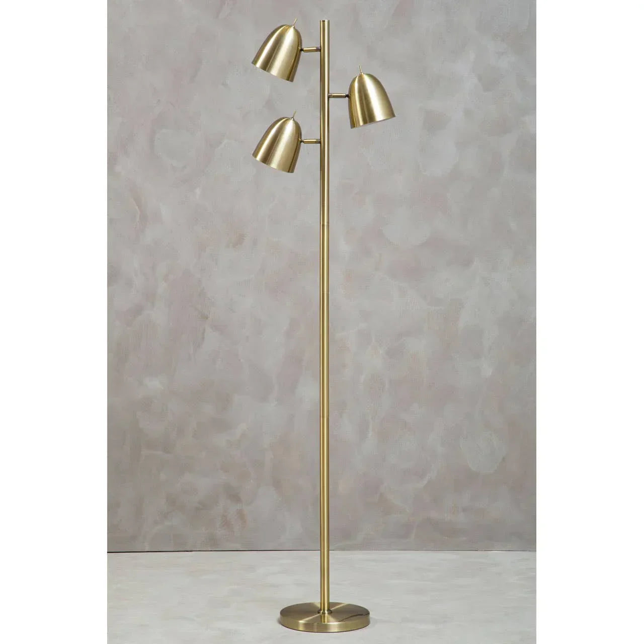 Brushed gold floor lamp with three adjustable metal shades on round base