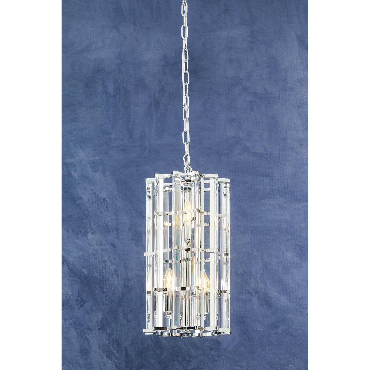 Chrome and crystal pendant light fixture with vertical glass rods against blue wall