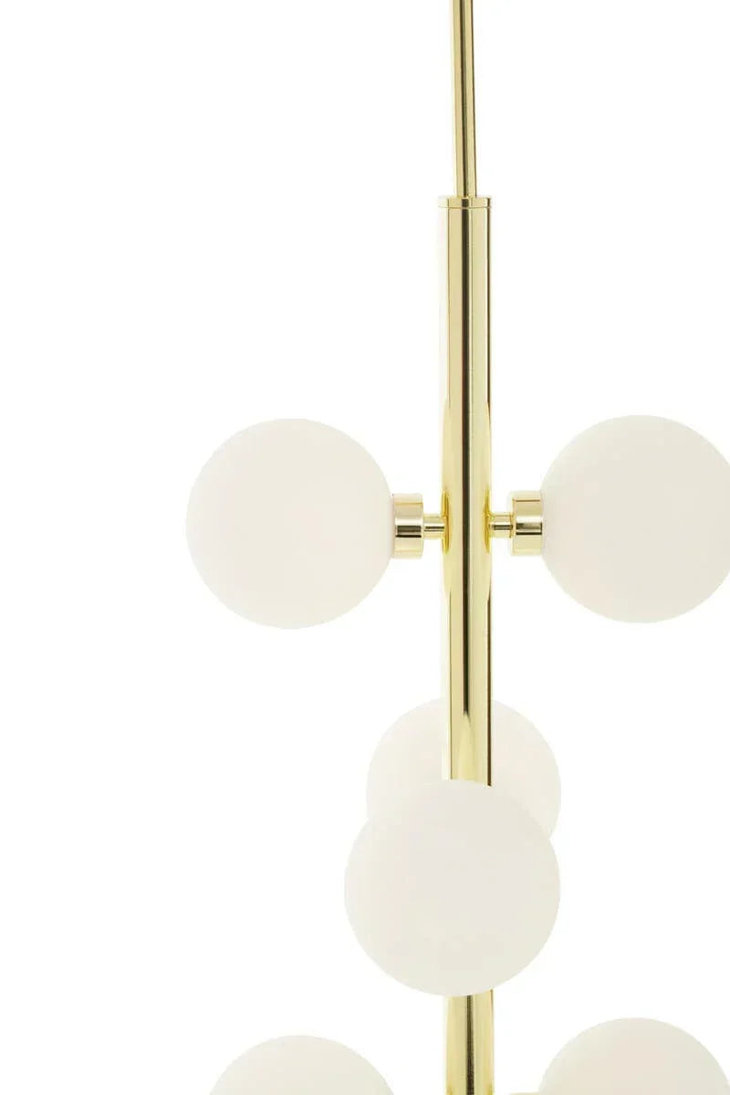 Modern brass floor lamp with white glass globes in vertical arrangement