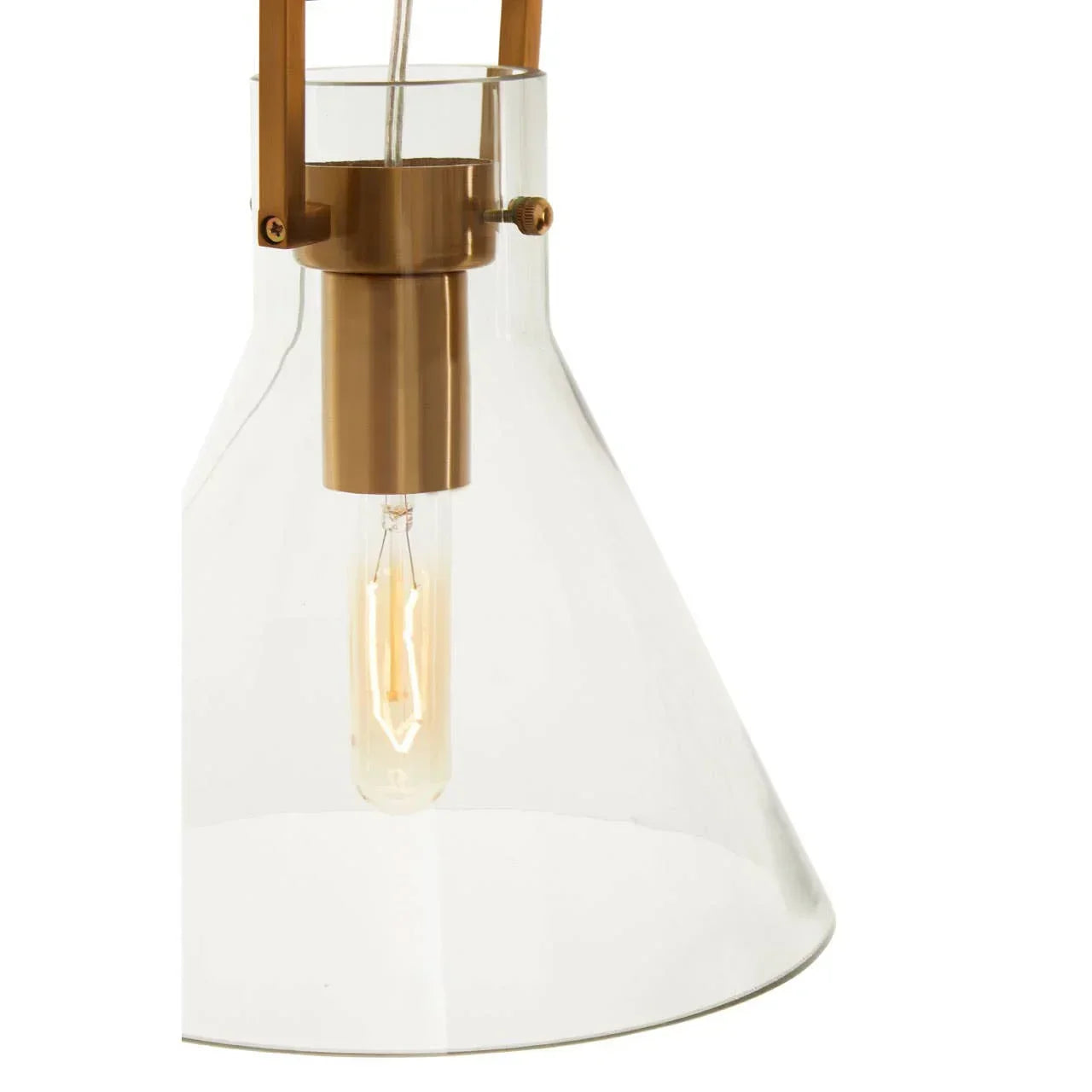Close-up of clear glass pendant light with exposed bulb and brass fixture detail