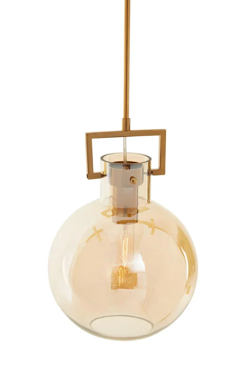 Gold pendant light with round amber glass shade and exposed bulb
