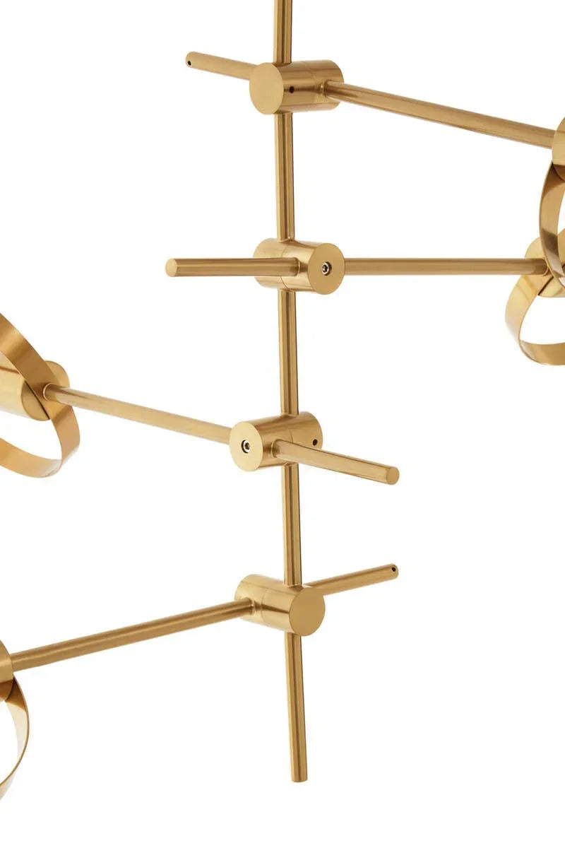 Gold metal chandelier rods intersecting in a modern, geometric lighting design