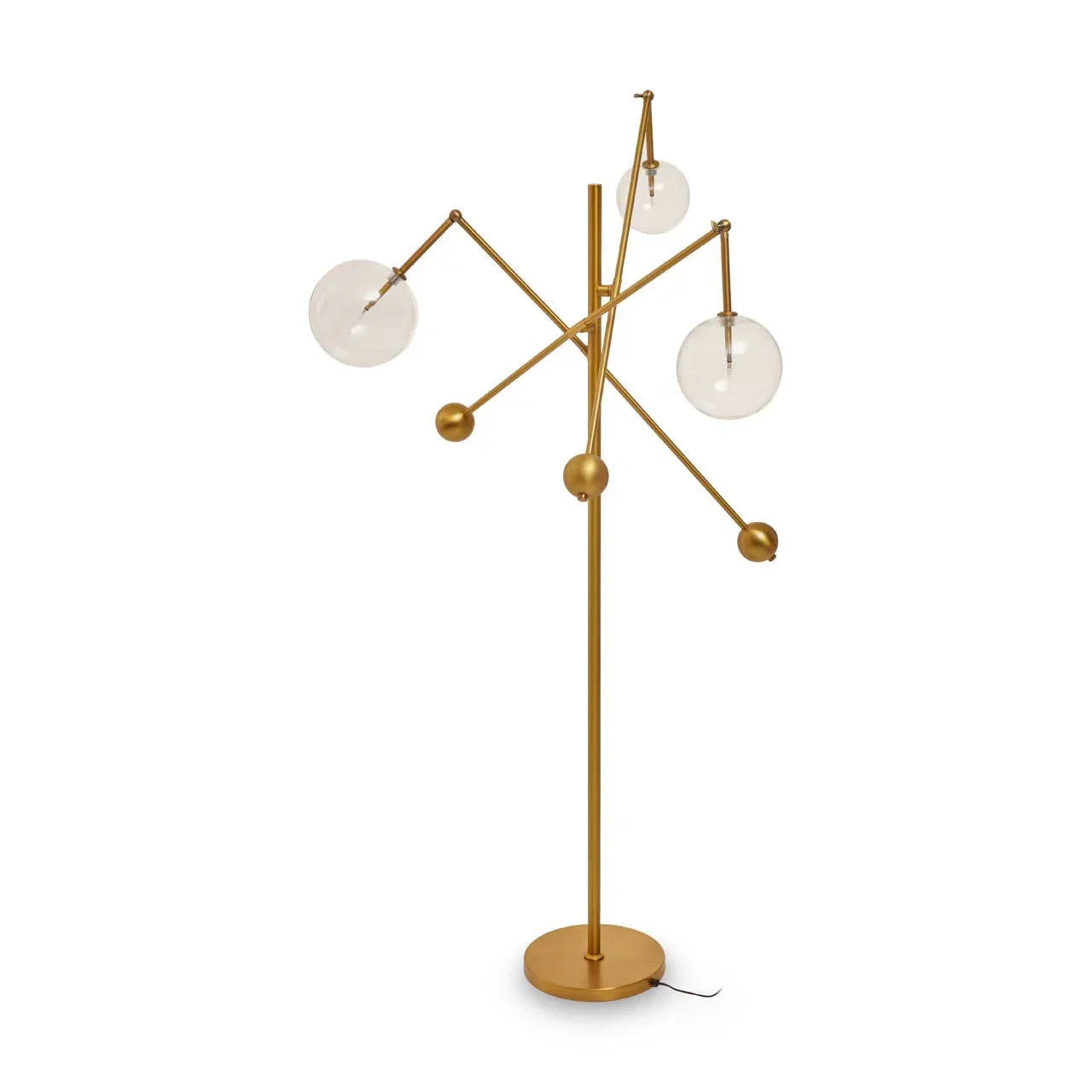 Gold floor lamp with three clear globe shades and modern branch design on white background