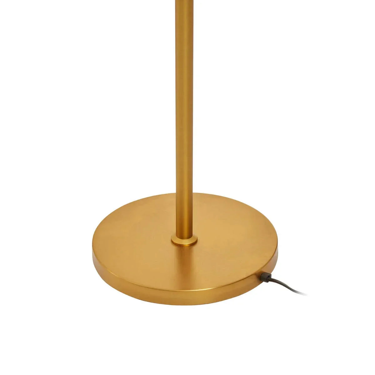 Gold metal floor lamp base with round shape and visible power cord