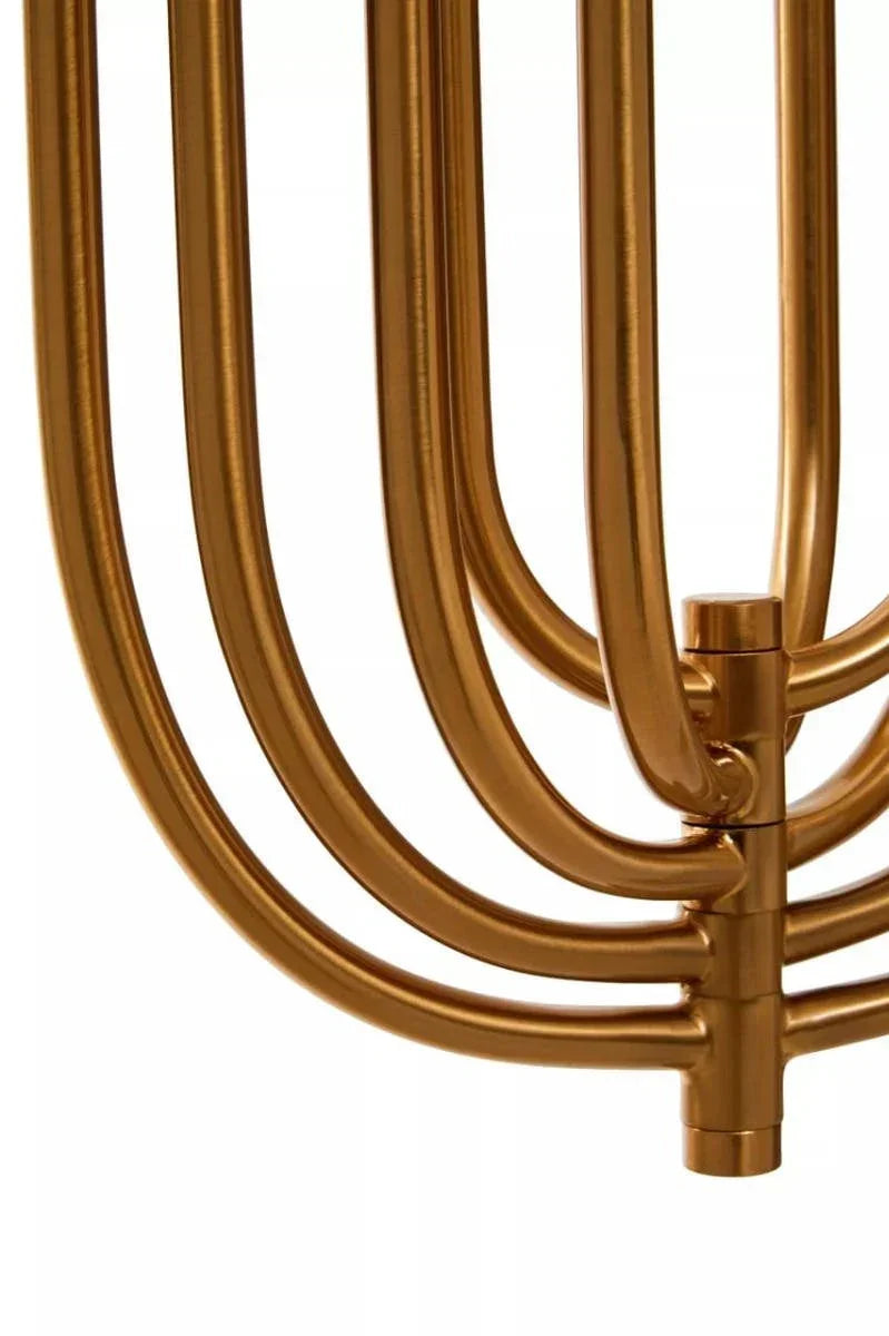 Gold metal table legs with curved design, close up on furniture detail