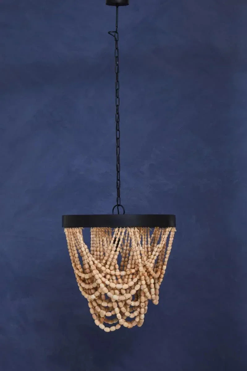Wooden bead chandelier light fixture with black metal frame against blue wall