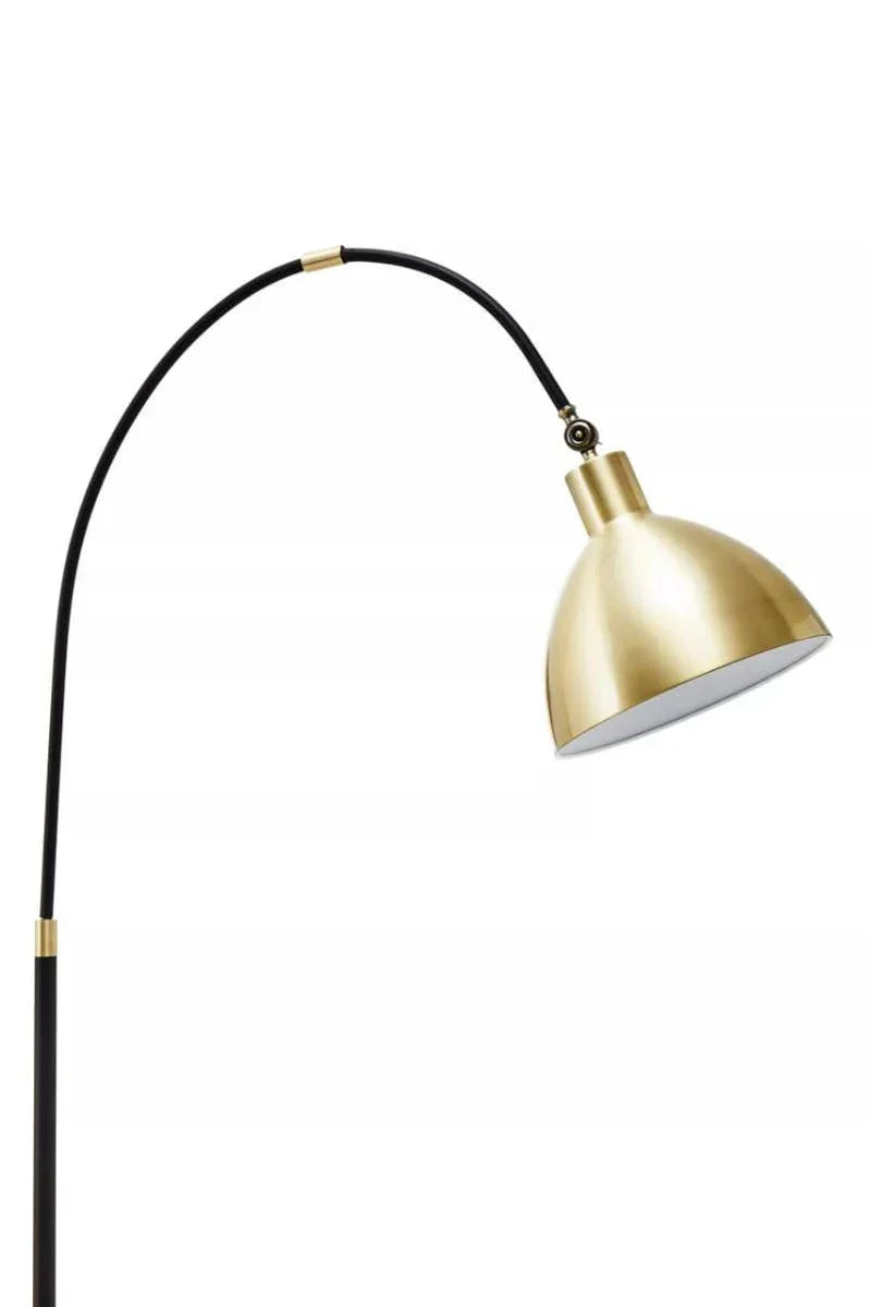 Brass dome floor lamp with black arched stand and adjustable shade
