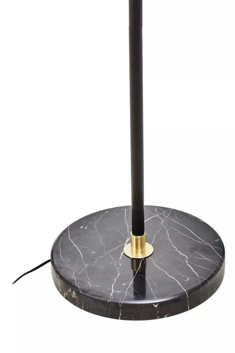 black marble lamp base with gold accent and upright black pole, close-up view