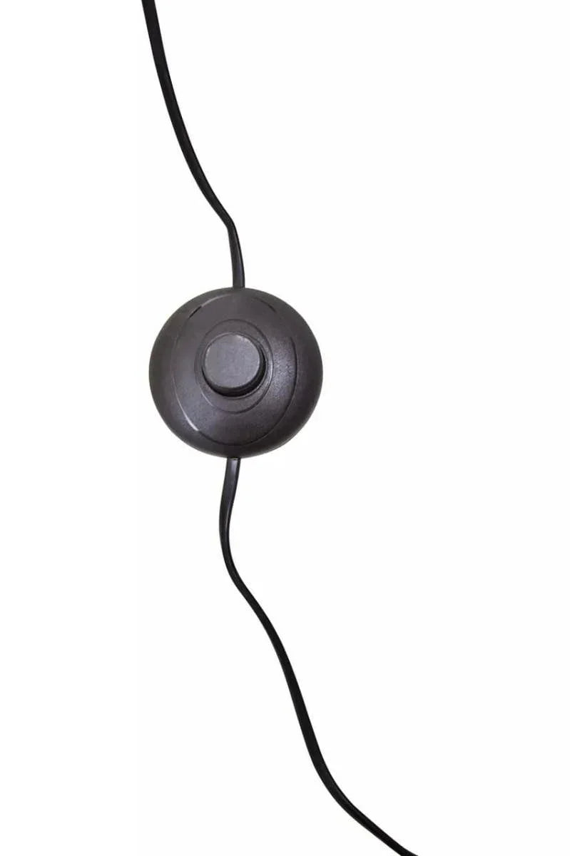 Black lamp foot switch with round button and cable against white background