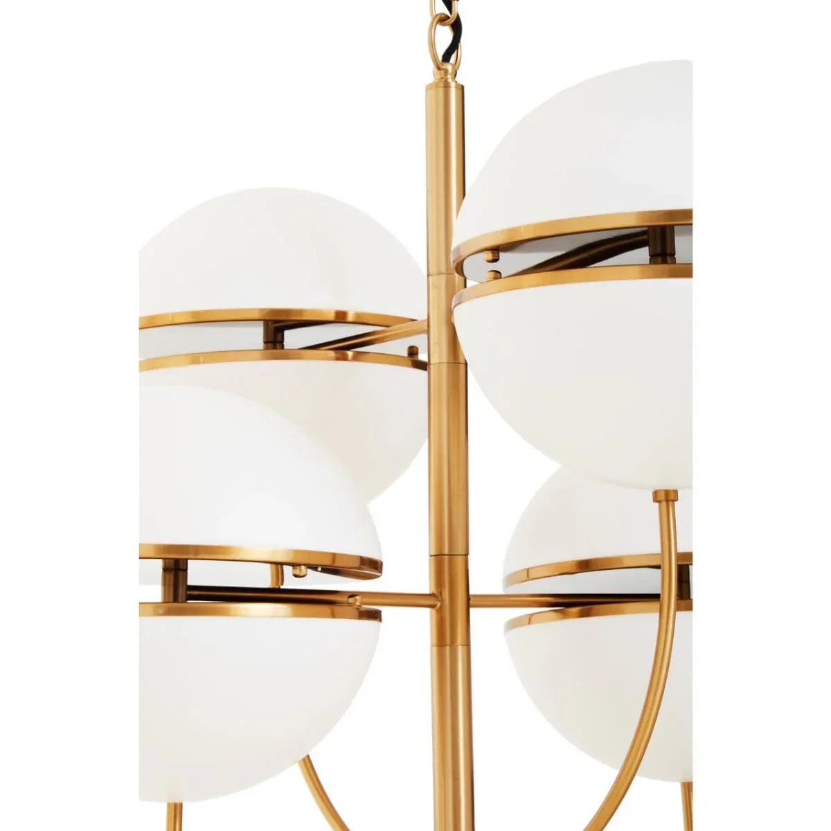 Modern chandelier with frosted glass globes and gold metal frame, close-up view