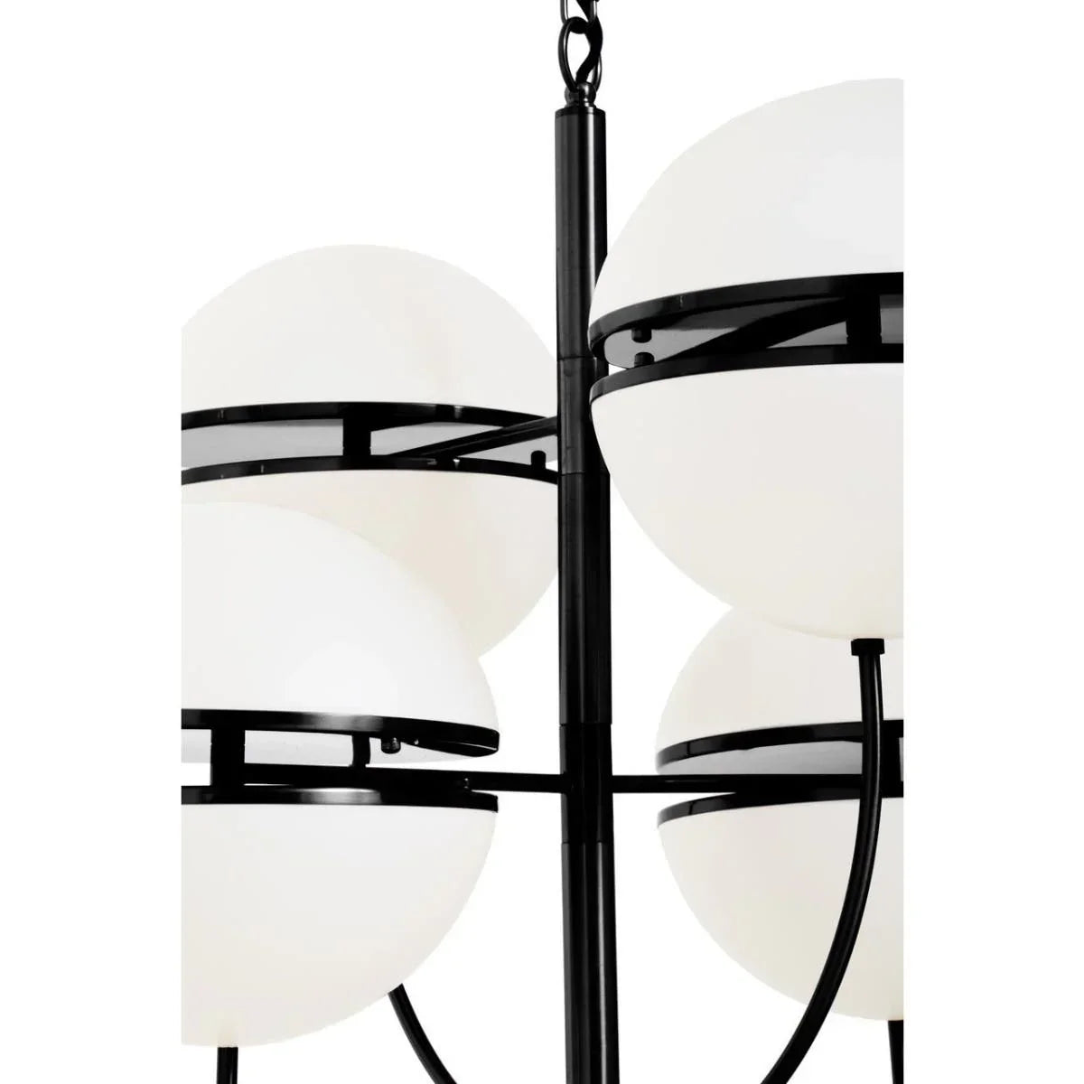 Modern black metal chandelier with six round white glass light shades close-up