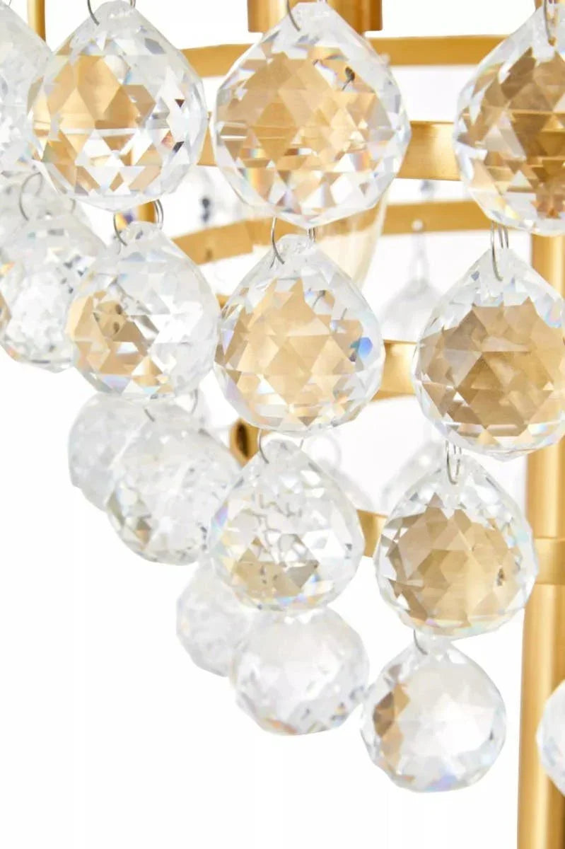 Close-up of crystal chandelier droplets on gold frame lighting fixture