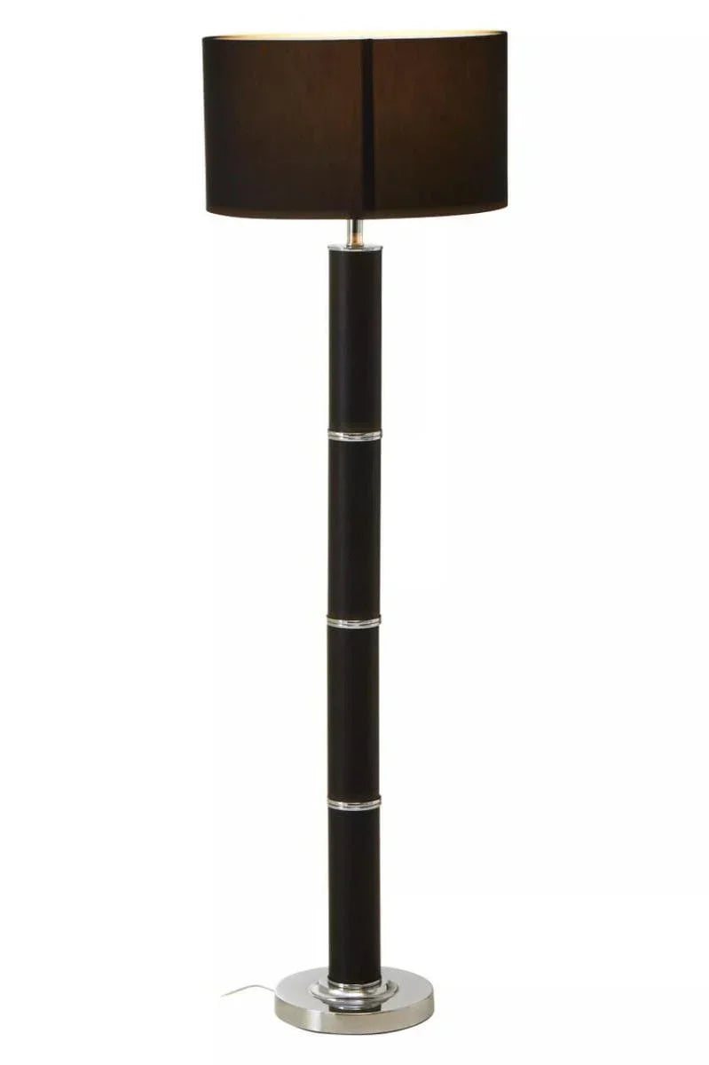 Modern black floor lamp with cylindrical base and chrome accents