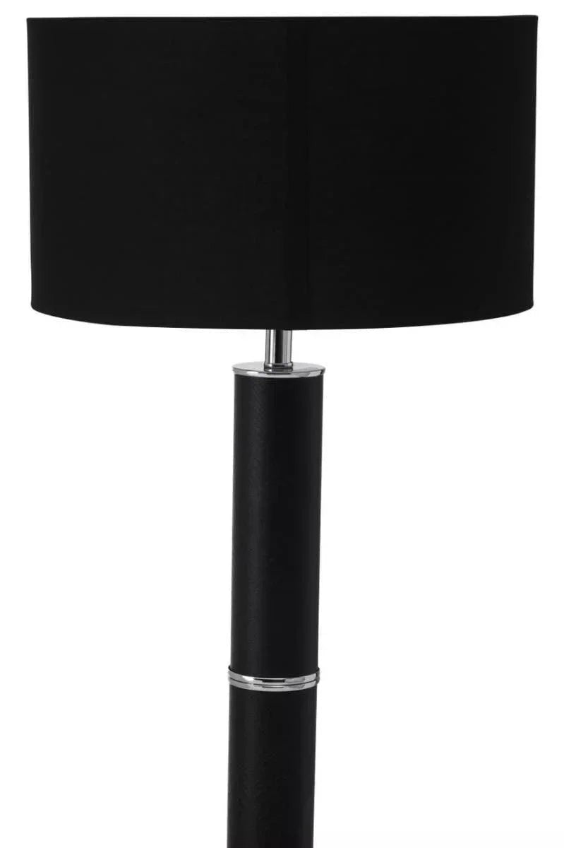 Black floor lamp with cylindrical shade and chrome accents