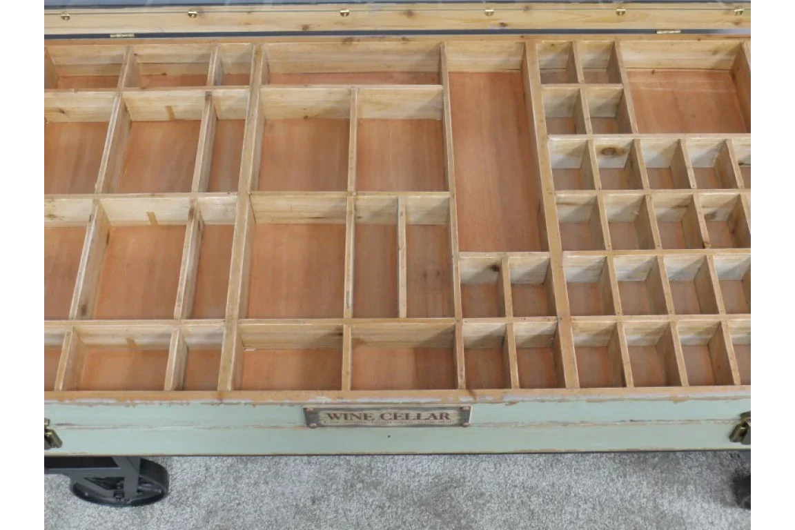 wooden wine storage coffee table with multiple bottle compartments and metal wheels
