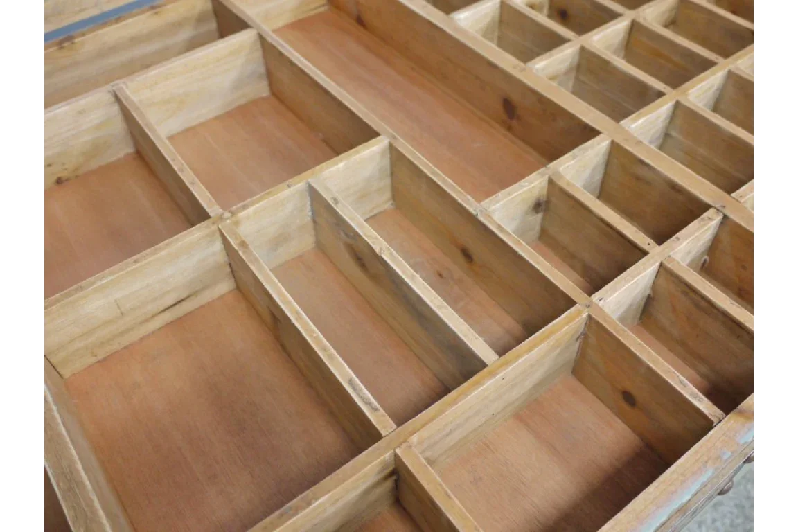 Wooden shelving unit with multiple open compartments, natural finish, close-up angle