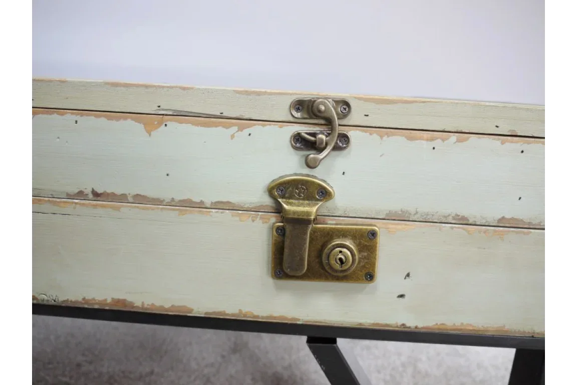 Distressed wood storage trunk with brass clasp and lock detail on front panel