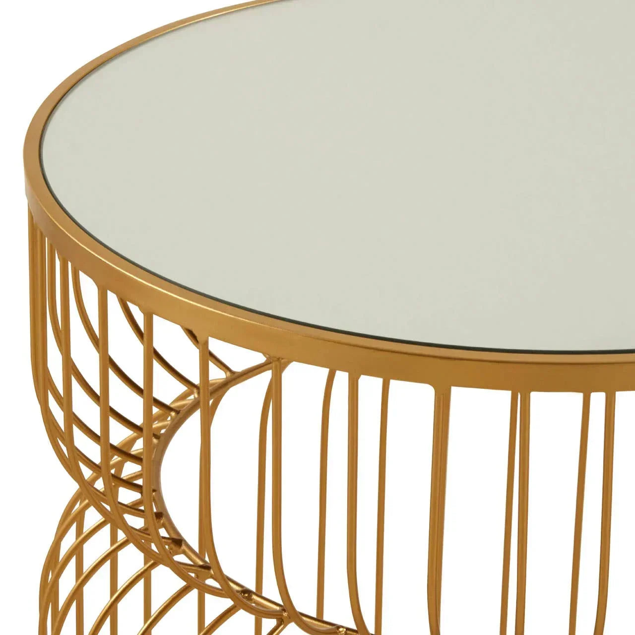 Round gold metal coffee table with glass top and open wire frame detail, close-up view