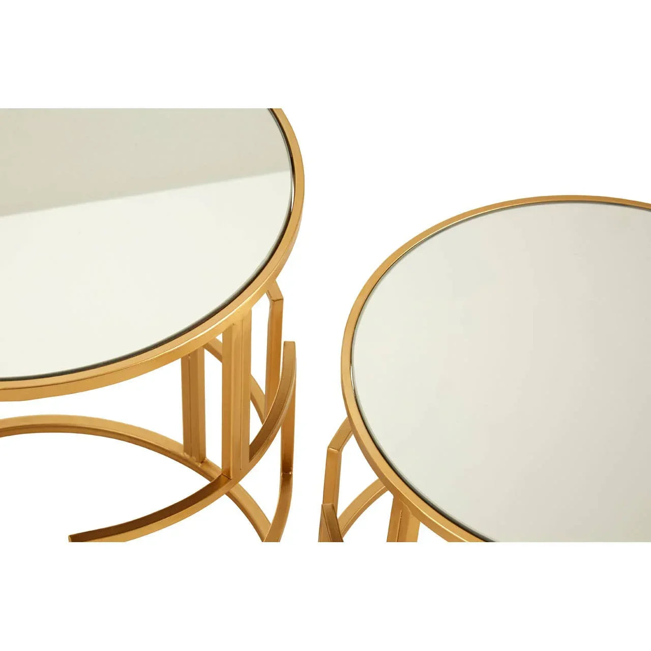 Round glass nesting tables with gold metal frames, close-up top view